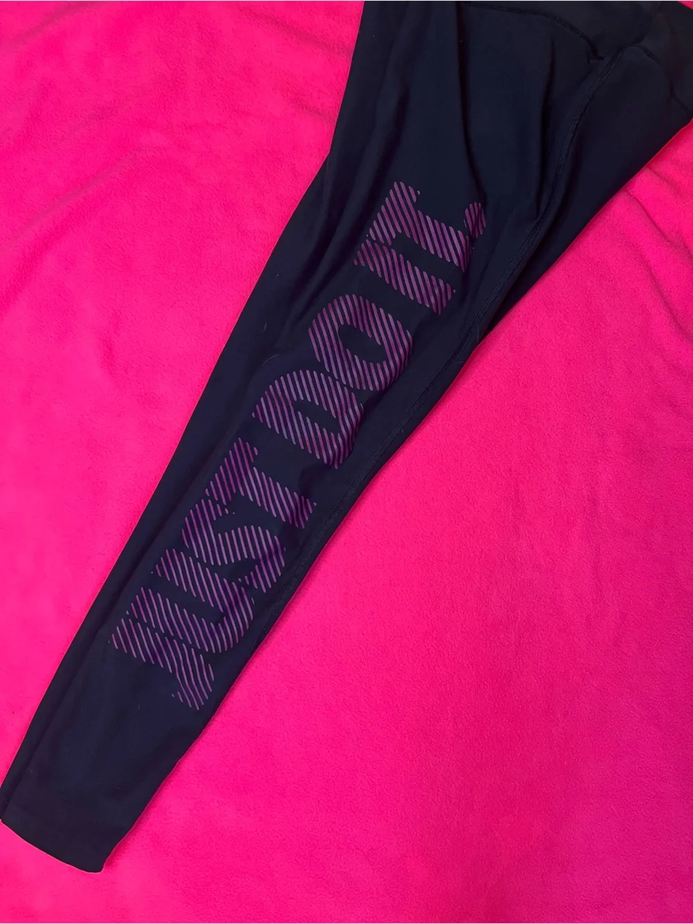 Nike Black Leggings with Purple Swoosh and Logo Accents
